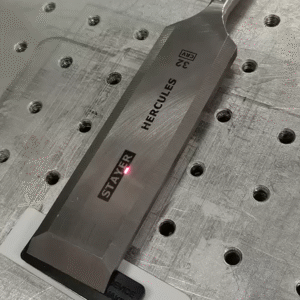 laser marking machine marks a black logo on stainless steel